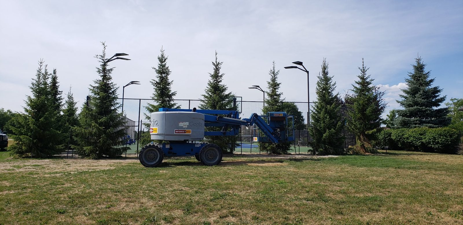 Pole lighting installed around an outdoor sports court